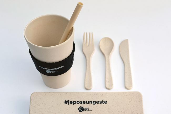 Wheat fiber utensils and a compostable bamboo cup on sale in the Space for Life gift shops.