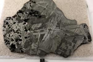 Seymchan meteorite (acquired in October 2019), 672 grams, 23 cm x 17.2 cm x 0.4 cm, Pallasite and Iron (IIE), discovered in Russia in 1967.